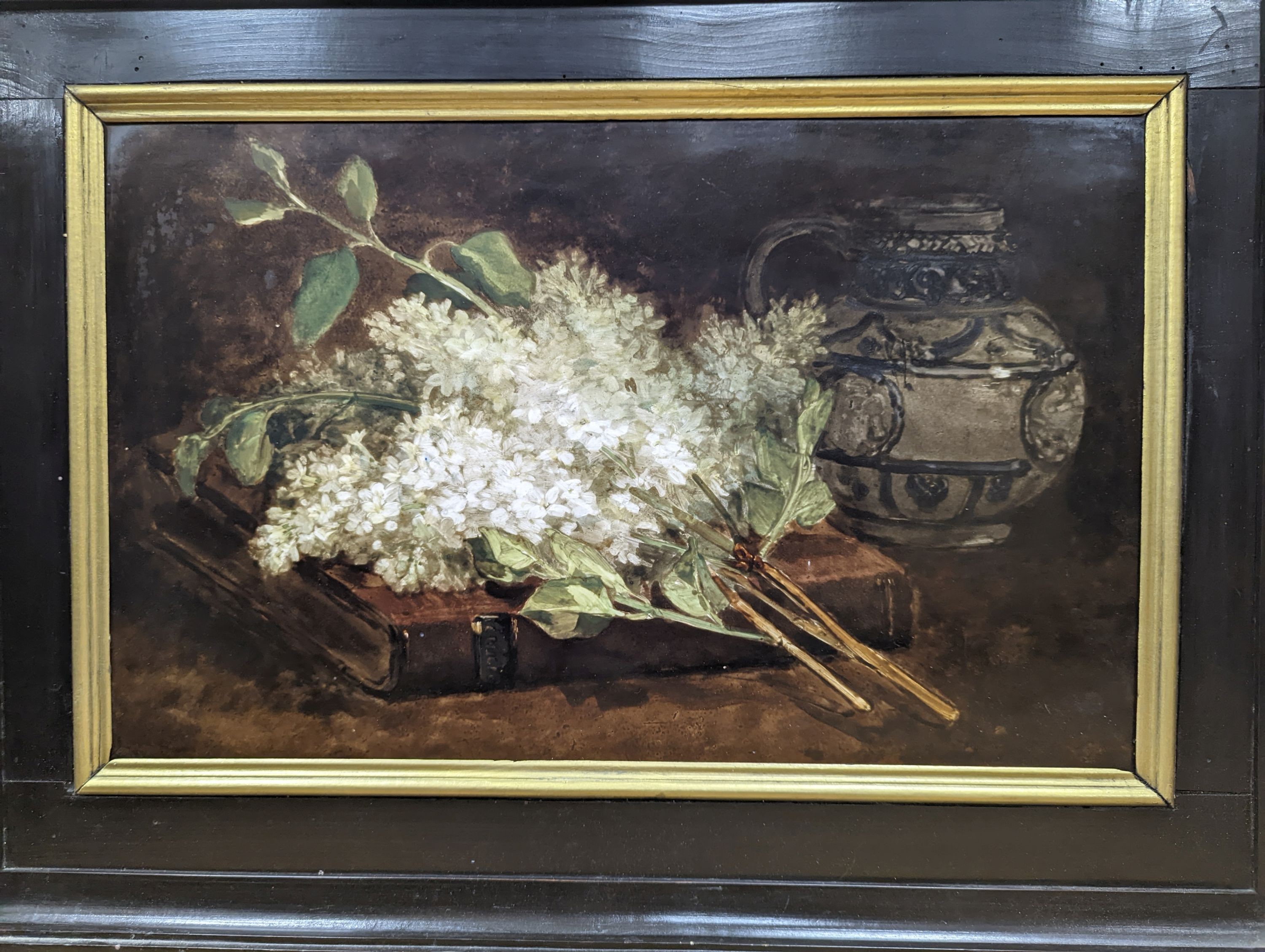 A 19th century porcelain plaque painted with a still life of lilac blossom and a stein, 29 x 46cm